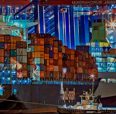 abstract busy background with a cargo ship and buildings in the background